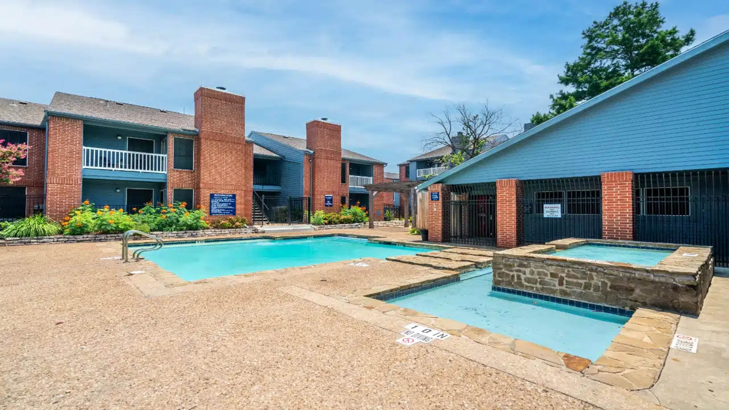 View of Ironhorse Flats apartments with pool in front