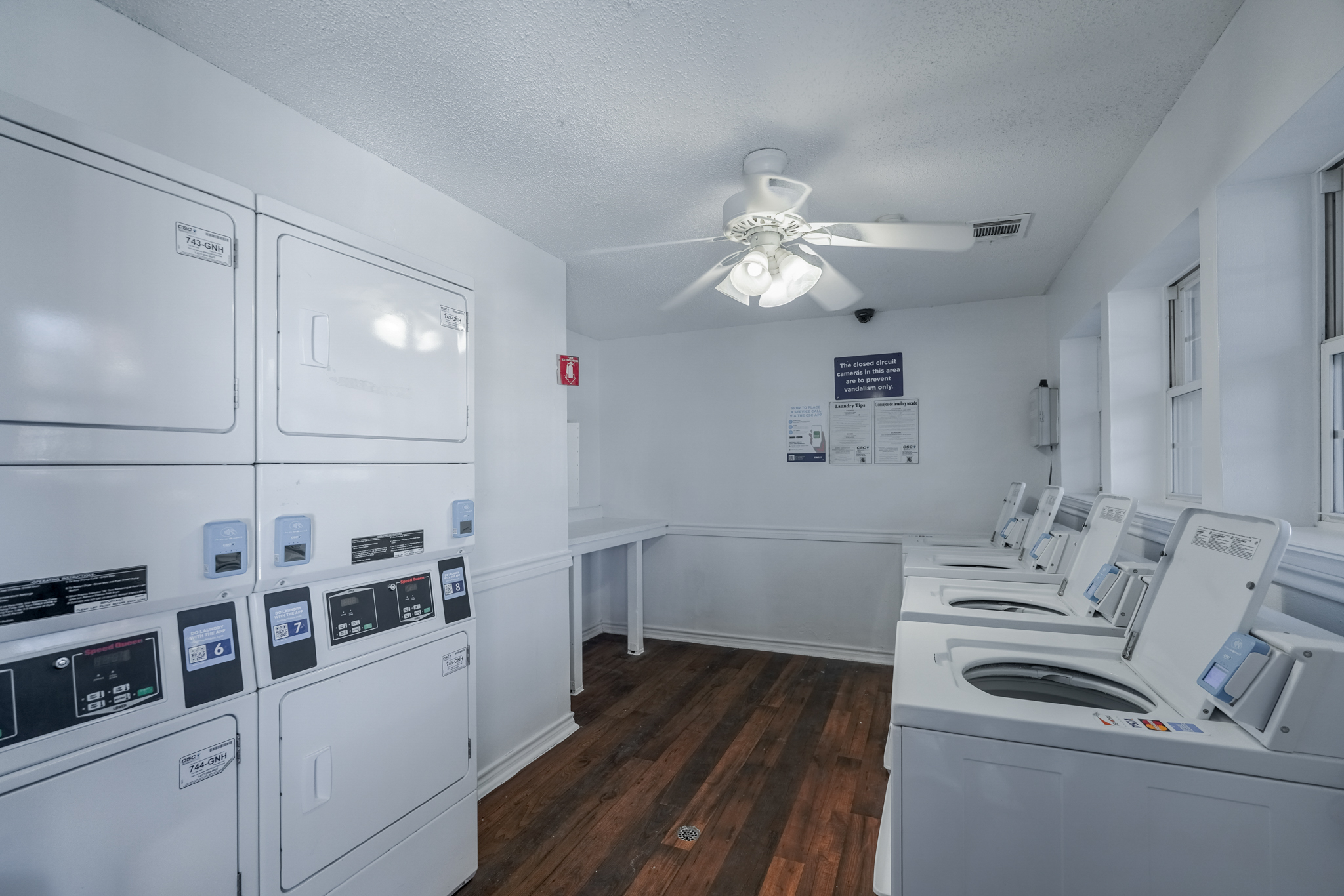 a laundry room with dryers and dryer