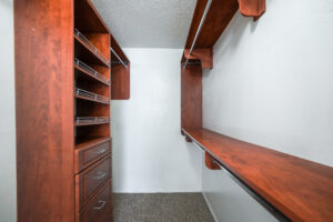 a closet with shelves and drawers