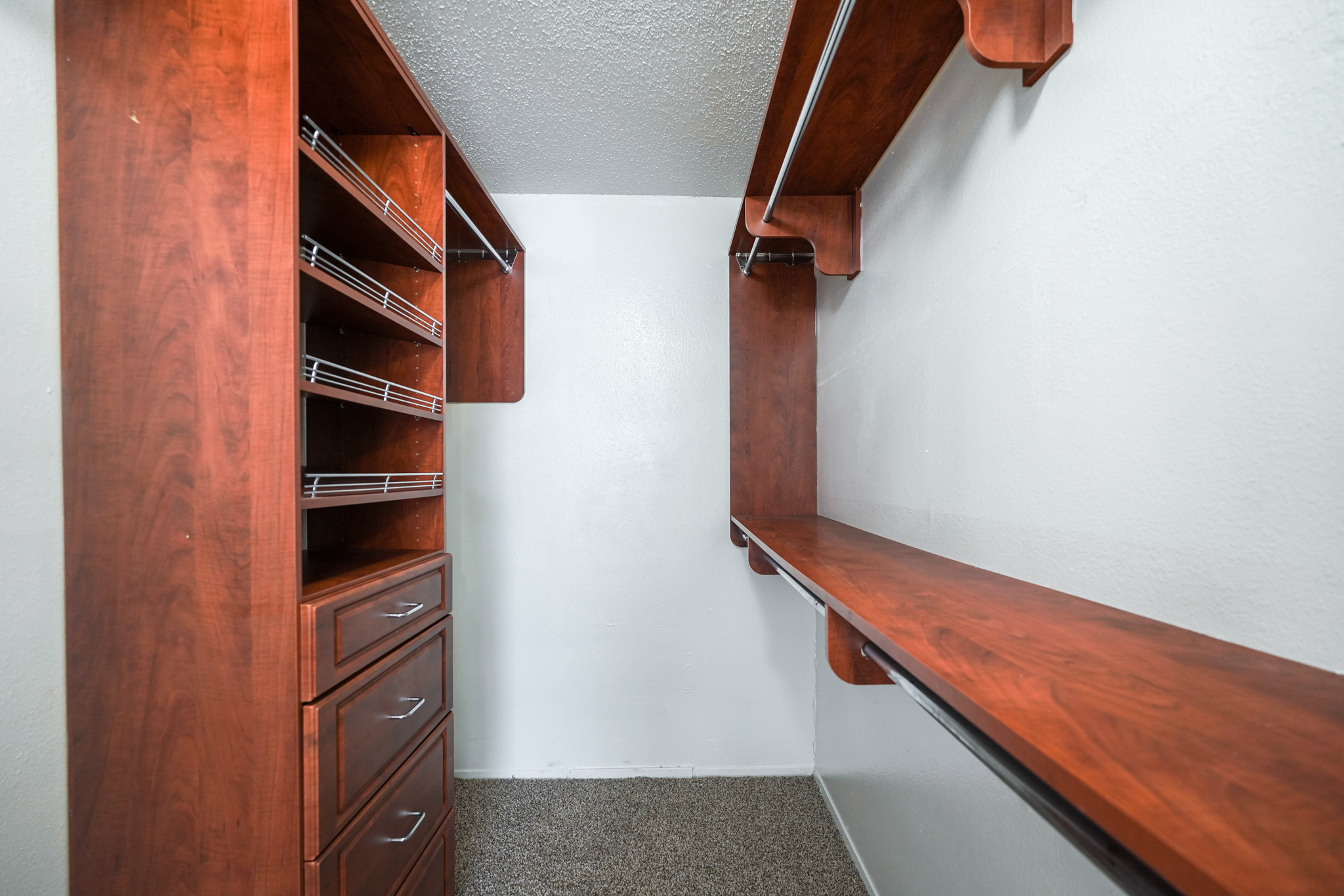 a closet with shelves and drawers