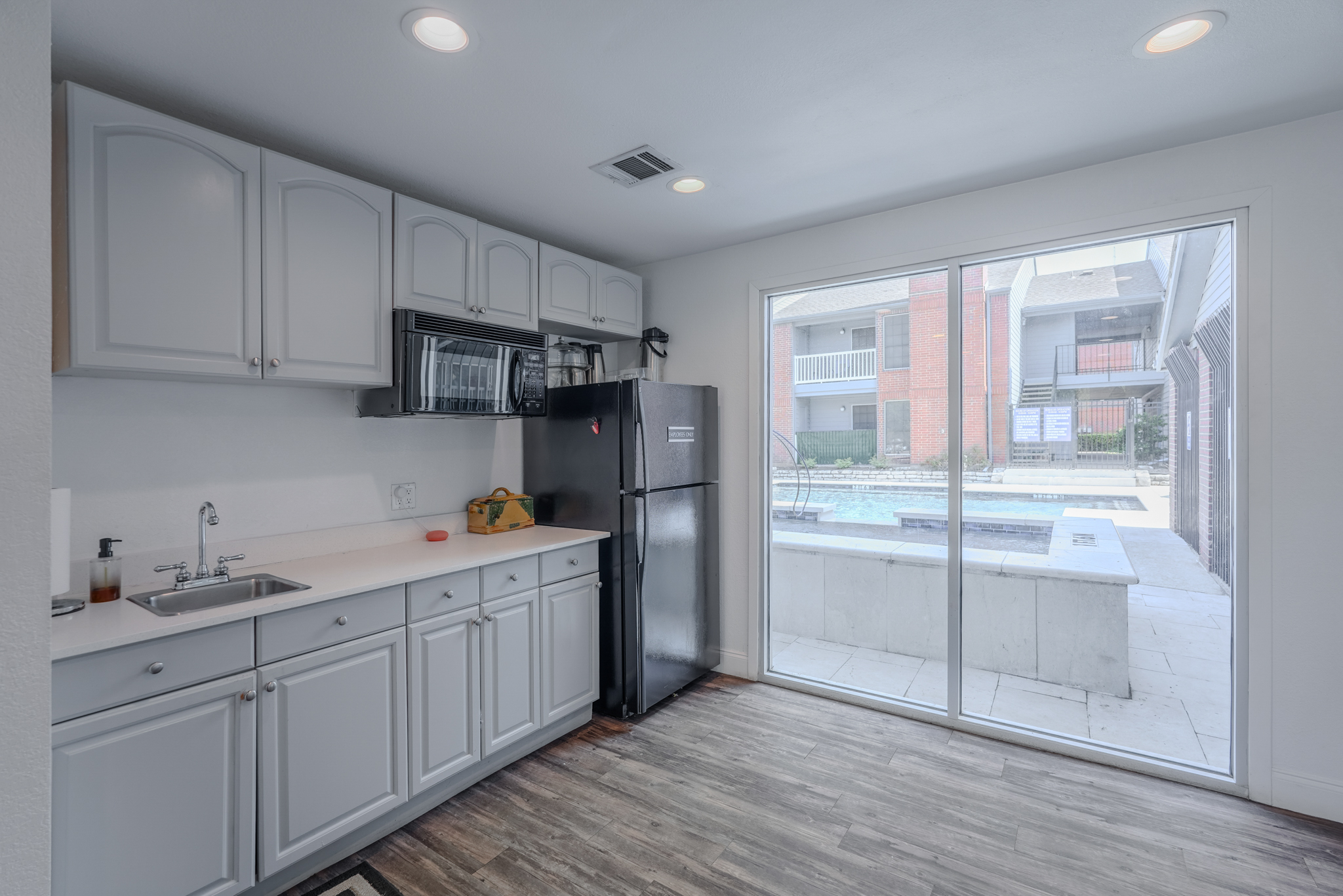 a kitchen with a large glass door