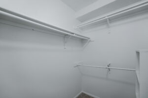 a white empty closet with shelves