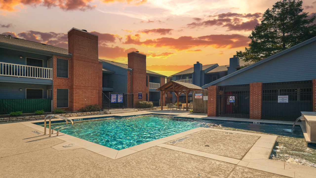 a pool with a building in the background