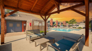 a covered patio with chairs and a pool